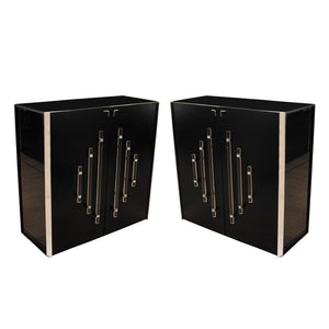 A pair of tall black lacquer cabinets