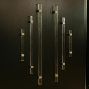 A pair of tall black lacquer cabinets