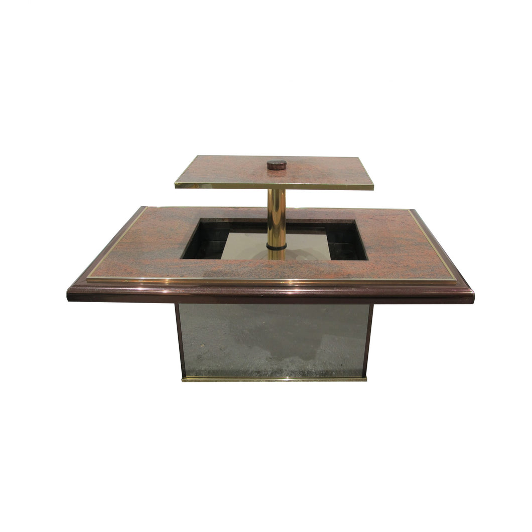 A granite bar coffee table with central lift, 1970's