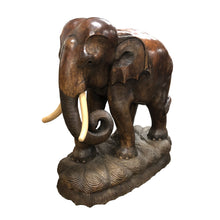 Load image into Gallery viewer, A pair of carved wood elephants