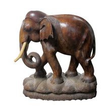 Load image into Gallery viewer, A pair of carved wood elephants