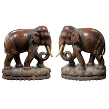 Load image into Gallery viewer, A pair of carved wood elephants
