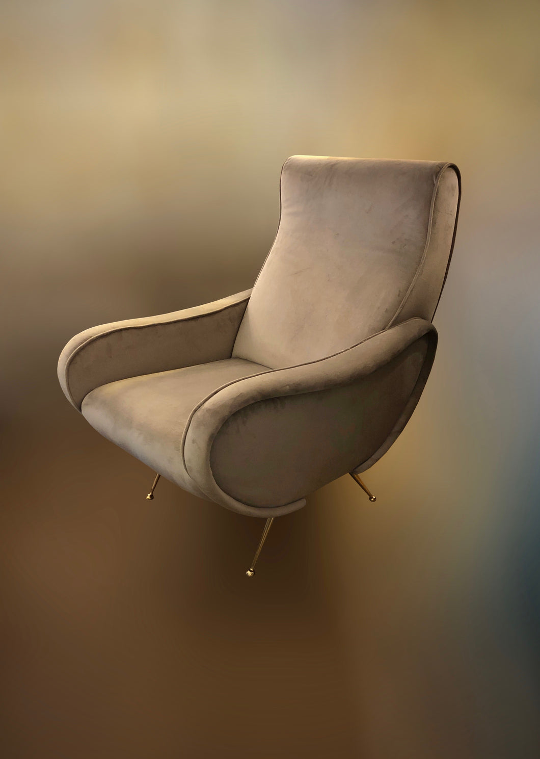 Pair of Italian armchairs with brass feet