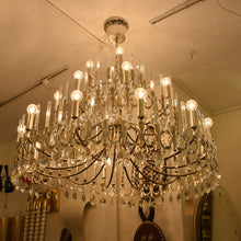 Load image into Gallery viewer, A large silver plated Gaetano Sciolari chandelier
