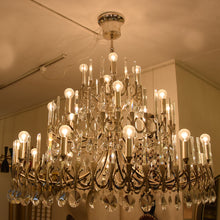 Load image into Gallery viewer, A large silver plated Gaetano Sciolari chandelier
