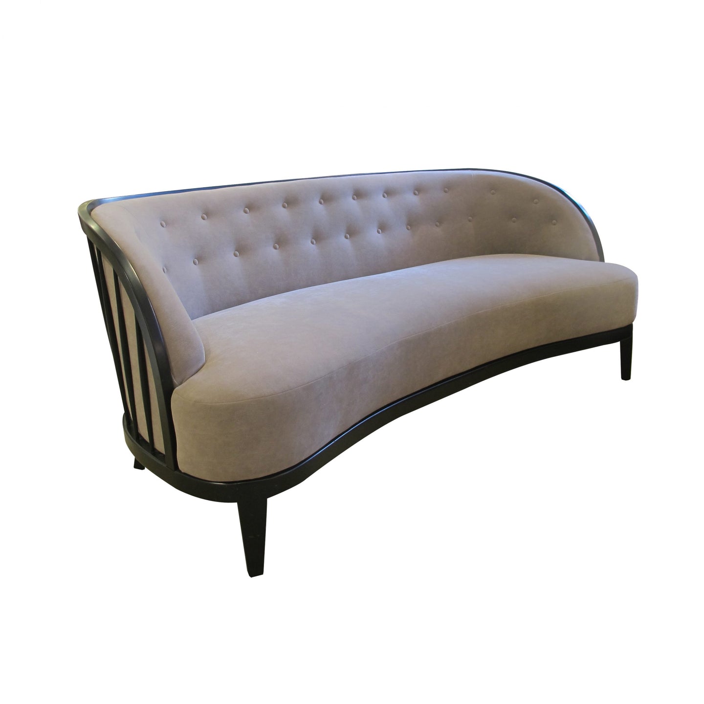 A 1940's three seater sofa with an ebonised frame