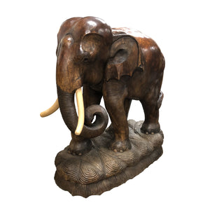 A pair of carved wood elephants