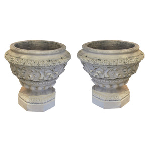 A pair of Victorian white terracotta urns