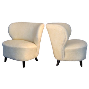 1940s Finnish pair of wingback lounge chairs, in lamb skin fabric
